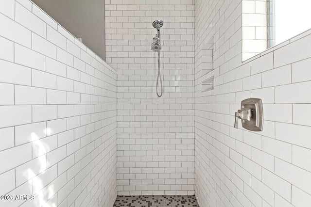 bathroom with tiled shower