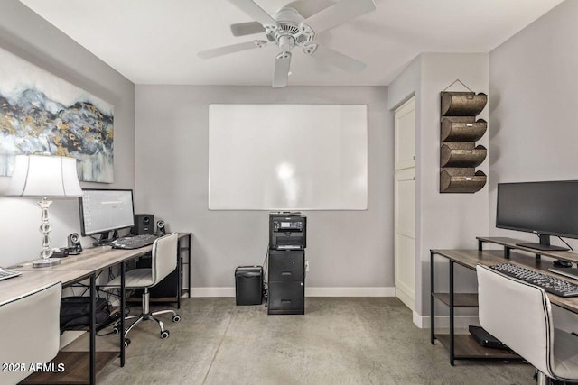 office area with concrete floors and ceiling fan