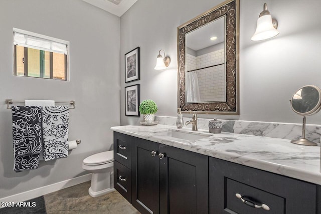 bathroom with curtained shower, vanity, and toilet