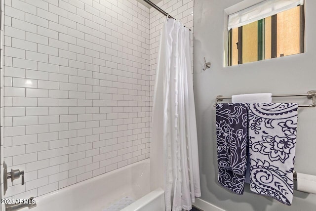 bathroom featuring shower / bath combination with curtain