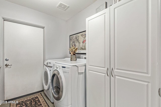 washroom featuring washer and clothes dryer