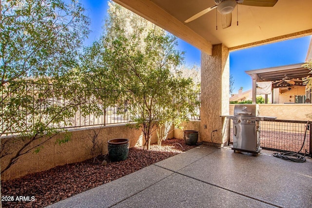 view of patio / terrace with area for grilling and ceiling fan