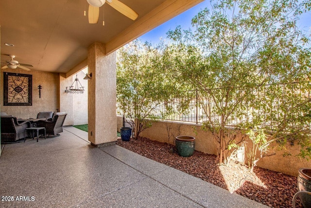 view of patio with outdoor lounge area and ceiling fan