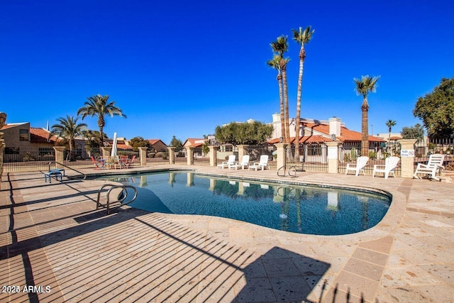 view of swimming pool with a patio area