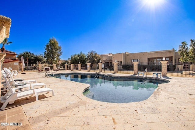 view of swimming pool with a patio area