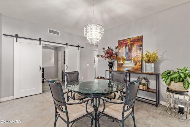 dining area with a barn door and a notable chandelier