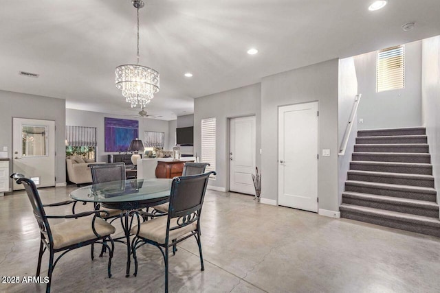 dining area with a notable chandelier