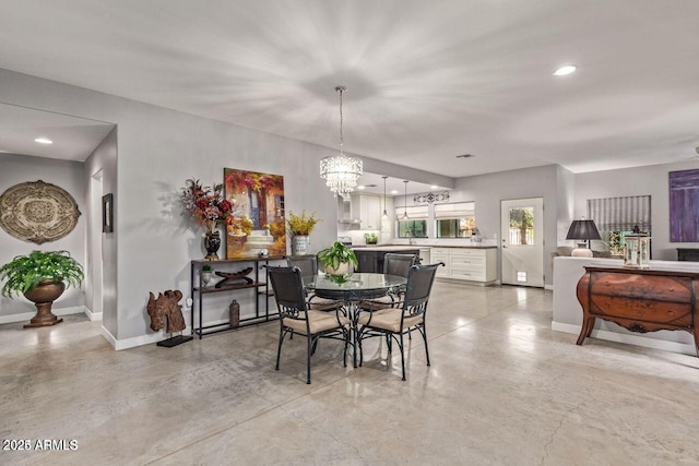 dining area featuring a notable chandelier