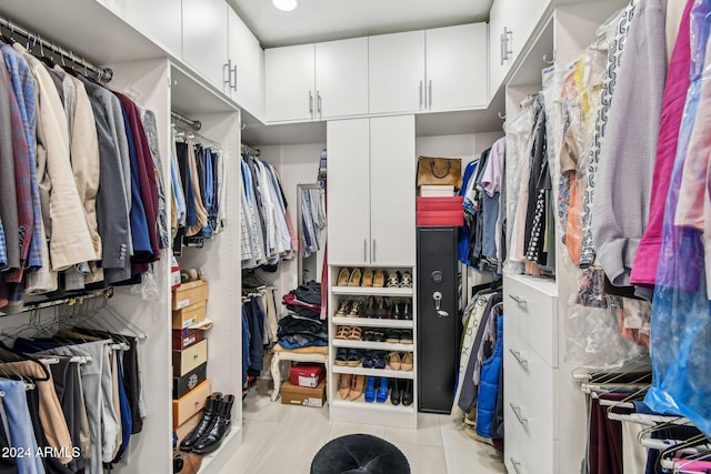 walk in closet featuring light tile patterned floors