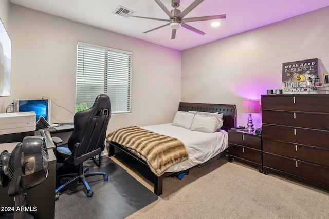 bedroom with ceiling fan and light carpet