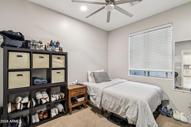 bedroom with ceiling fan and carpet