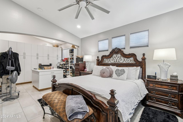 tiled bedroom featuring ceiling fan and lofted ceiling