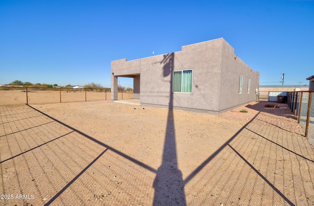 back of property featuring a patio