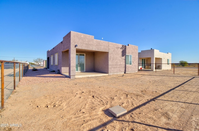 back of house featuring a patio