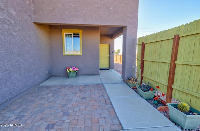 doorway to property featuring a patio area