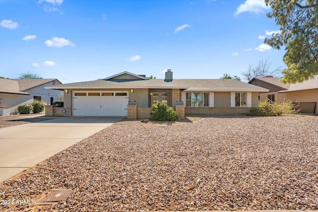 single story home featuring a garage