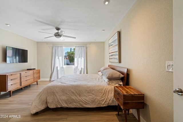 bedroom featuring ceiling fan and light hardwood / wood-style flooring