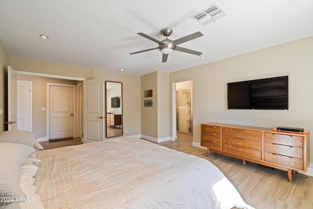 bedroom with ceiling fan and light hardwood / wood-style floors