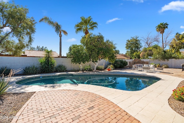 view of pool featuring a patio area