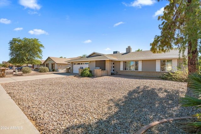 single story home featuring a garage