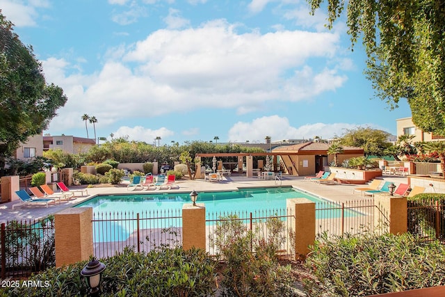 view of swimming pool with a patio