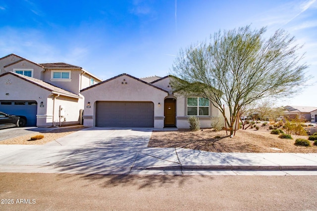 mediterranean / spanish-style home with a garage, a residential view, concrete driveway, and stucco siding