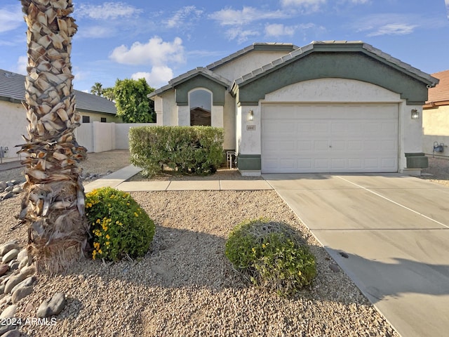 single story home with a garage