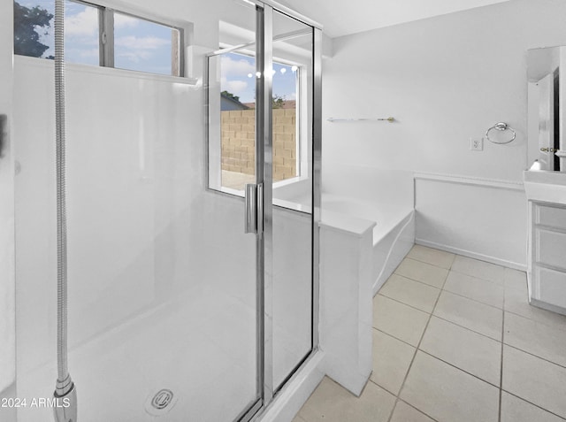 bathroom featuring tile patterned floors and a bathing tub