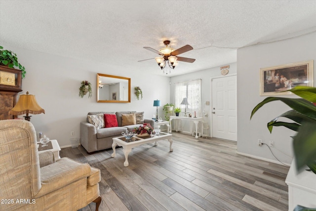 614 N Pioneer Cir, Mesa, AZ 85203 - living area featuring a ceiling fan, a textured ceiling, wood finished floors, and baseboards