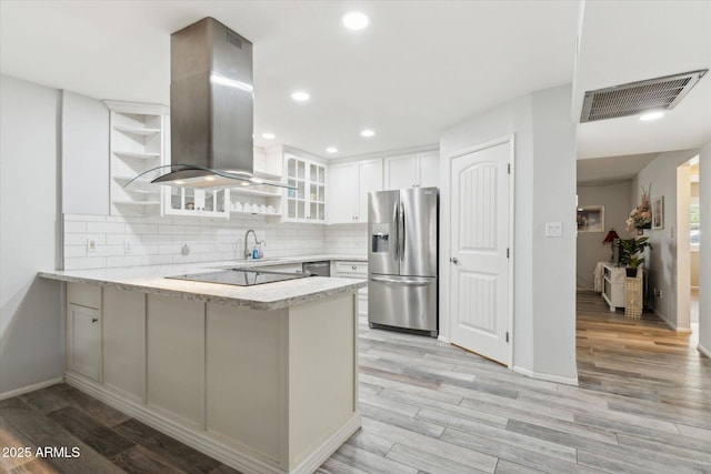 614 N Pioneer Cir, Mesa, AZ 85203 - kitchen featuring stainless steel appliances, island range hood, a peninsula, open shelves, and glass insert cabinets