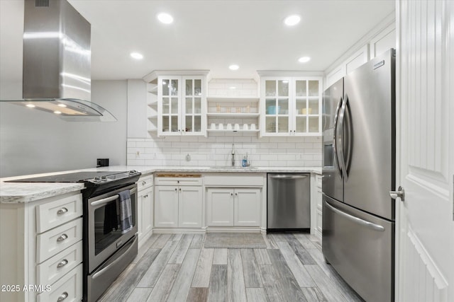 614 N Pioneer Cir, Mesa, AZ 85203 - kitchen featuring stainless steel appliances, wall chimney exhaust hood, open shelves, a sink, and white cabinets