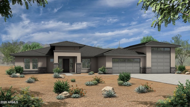 prairie-style house with a garage, brick siding, decorative driveway, and stucco siding