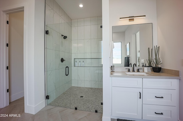 full bathroom featuring recessed lighting, baseboards, a shower stall, and vanity