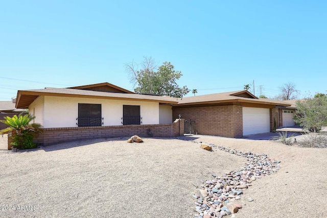 single story home with a garage