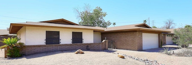 1531 W Plana Ave, Mesa, AZ 85202 - ranch-style house featuring an attached garage, brick siding, and stucco siding