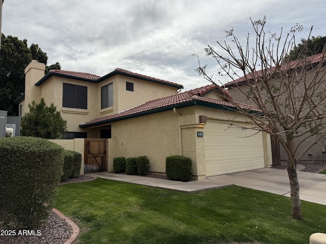 mediterranean / spanish house with a tiled roof, driveway, and stucco siding