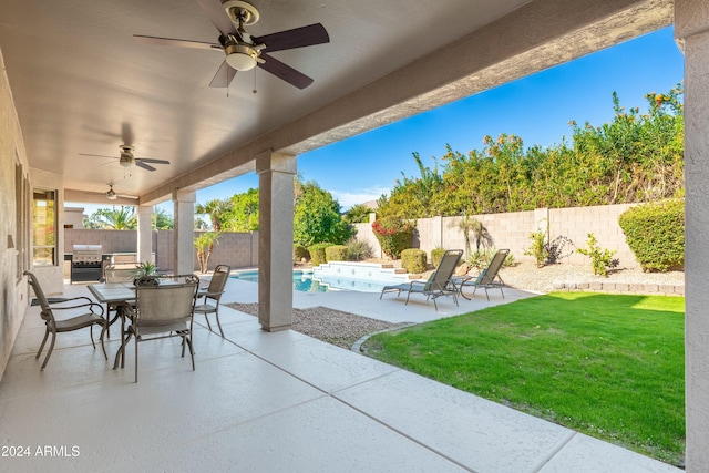 view of patio / terrace featuring ceiling fan, a fenced in pool, and grilling area