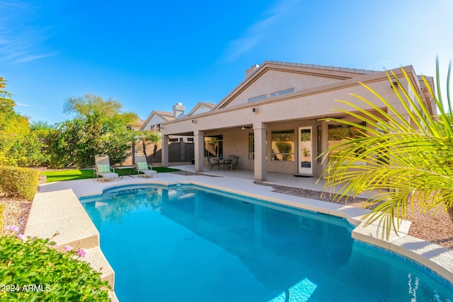 view of pool featuring a patio and ceiling fan