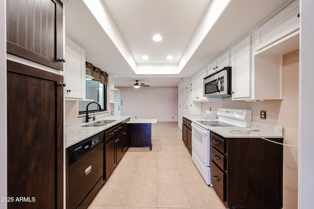 4916 E Hopi St, Phoenix, AZ 85044 - kitchen with white electric stove, a sink, black dishwasher, stainless steel microwave, and a raised ceiling