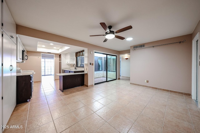 4916 E Hopi St, Phoenix, AZ 85044 - kitchen with visible vents, white cabinets, electric range oven, stainless steel microwave, and light countertops