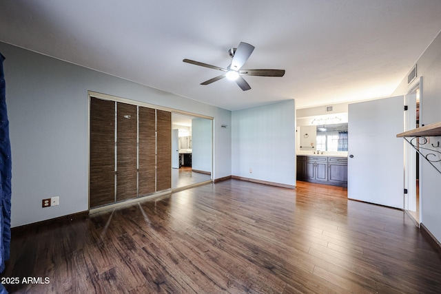 4916 E Hopi St, Phoenix, AZ 85044 - unfurnished living room featuring visible vents, a ceiling fan, a sink, wood finished floors, and baseboards