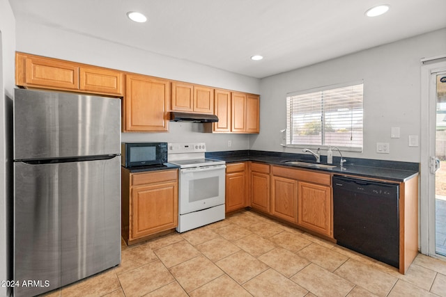 kitchen with sink, light tile patterned flooring, and black appliances