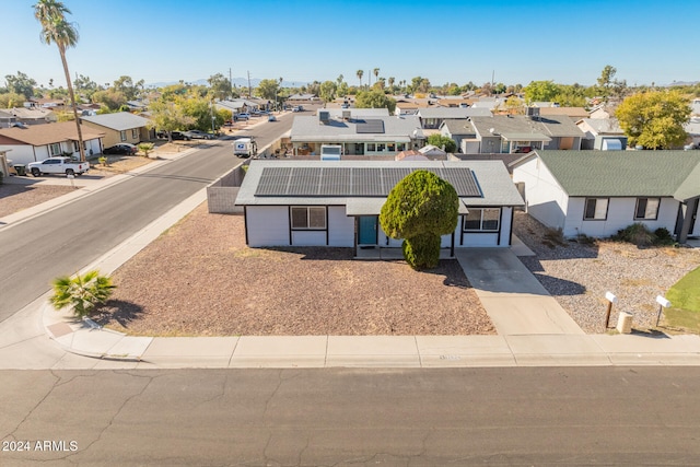 view of front of property with solar panels