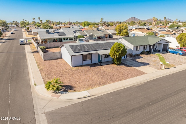 birds eye view of property featuring a mountain view