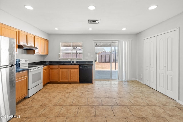 kitchen featuring white range with electric cooktop, sink, stainless steel fridge, light tile patterned floors, and black dishwasher