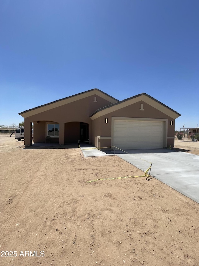 3821 S 343rd Ave, Tonopah, AZ 85354 - single story home featuring stucco siding, driveway, and a garage