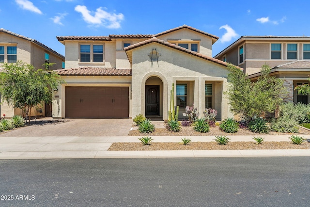 21032 E Thornton Rd, Queen Creek, AZ 85142 - mediterranean / spanish-style home featuring a tile roof, stucco siding, driveway, and a garage