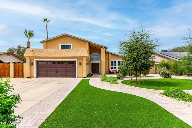 3358 W Sandra Ter, Phoenix, AZ 85053 - view of front of home with driveway, stucco siding, and a gate