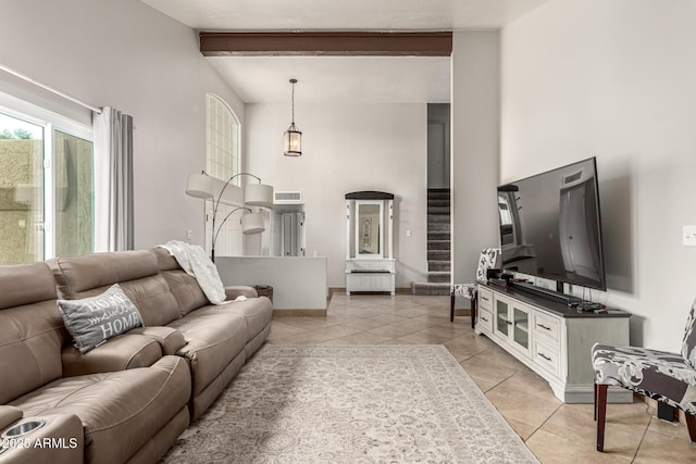 3358 W Sandra Ter, Phoenix, AZ 85053 - living room featuring light tile patterned flooring, high vaulted ceiling, and baseboards