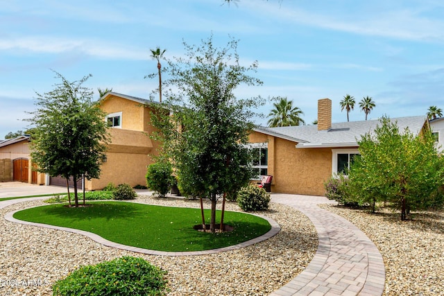 3358 W Sandra Ter, Phoenix, AZ 85053 - view of front facade featuring stucco siding and a front yard